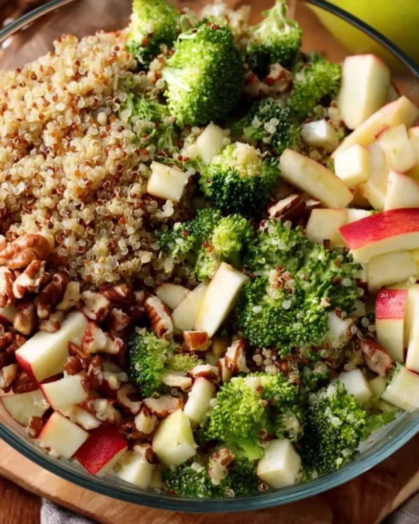 A vibrant Broccoli Apple Quinoa Salad with fresh ingredients and bright colors.