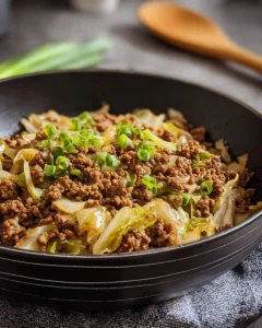 Plate of low-carb Mongolian ground beef with cabbage and vegetables