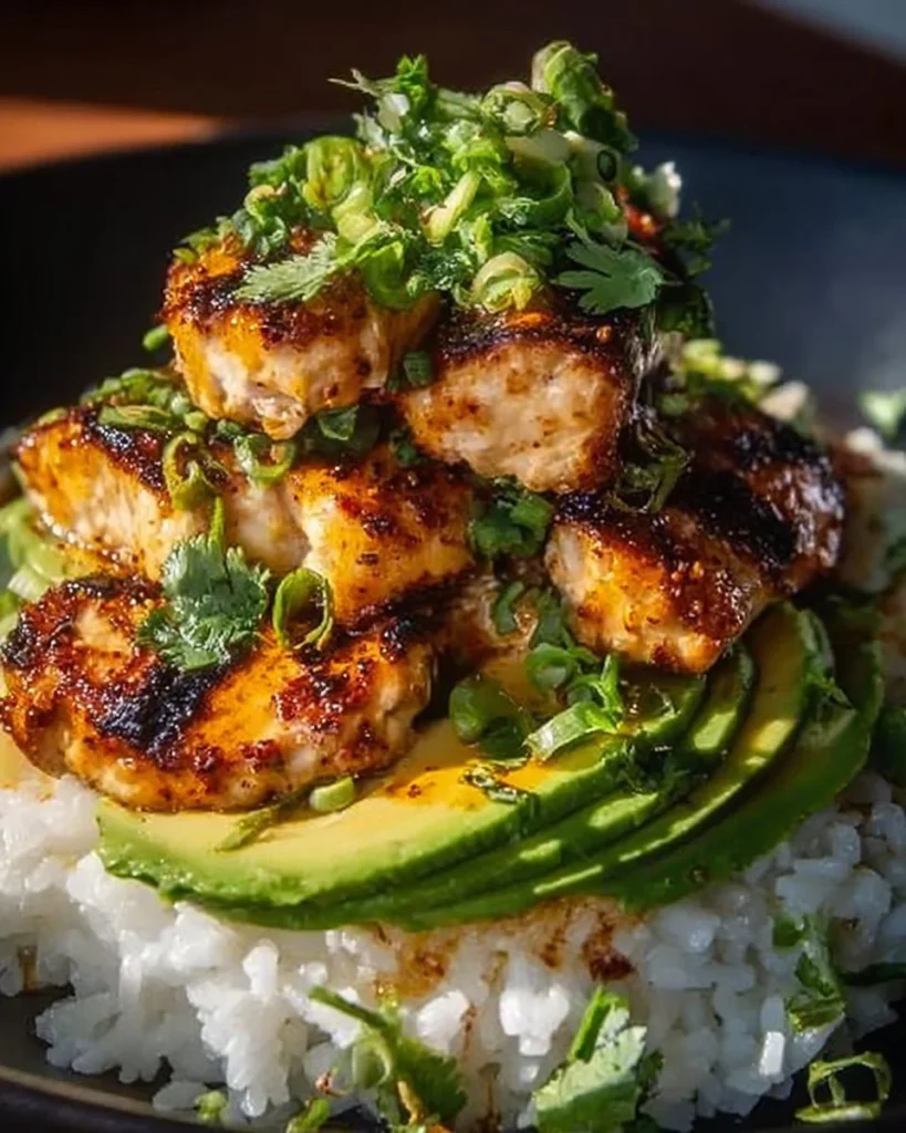Honey lime chicken served with avocado rice stack for a delicious meal