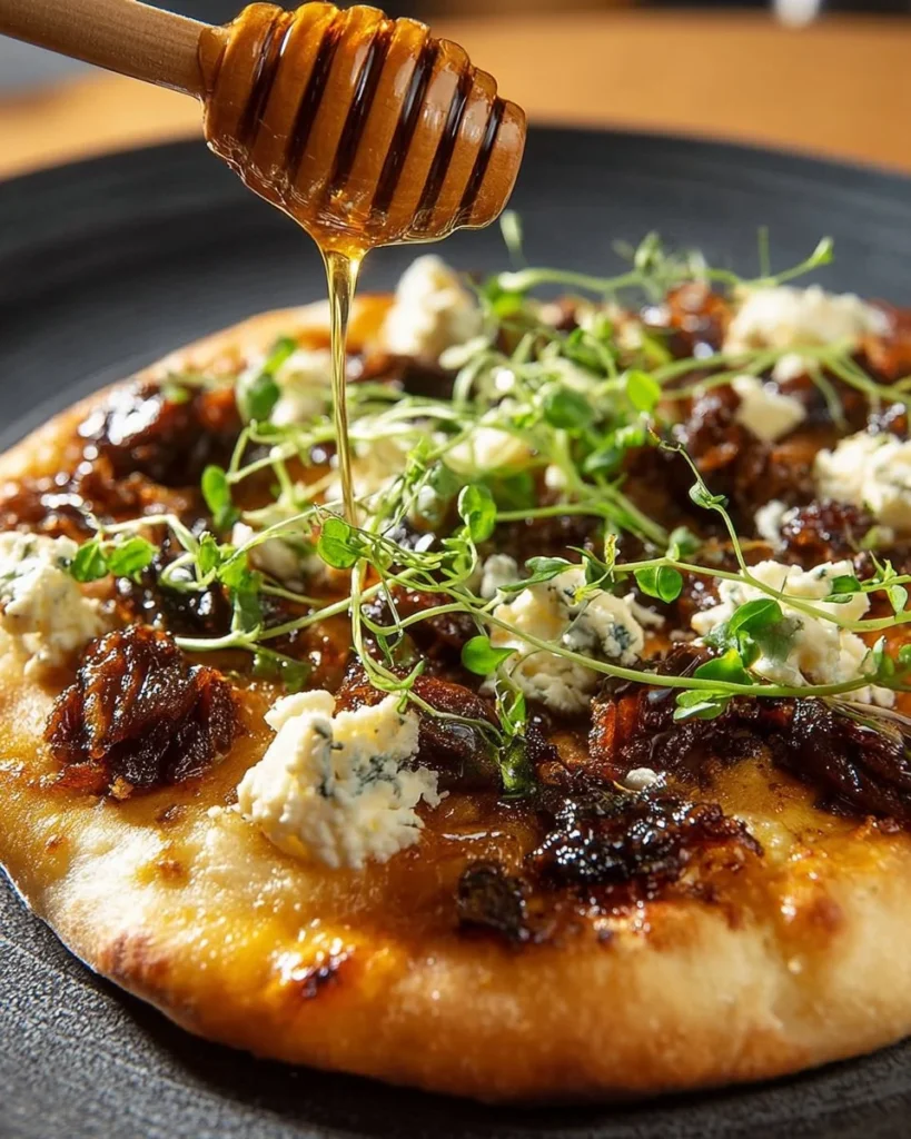 Delicious Sausage Ricotta Honey Hot Pizza slice topped with fresh ingredients